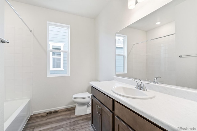 13412 E 110th Way, Commerce City, CO 80022 - full bath with vanity, wood finished floors, and shower / tub combination