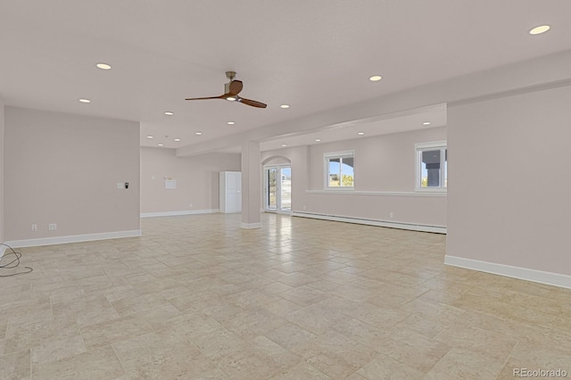 unfurnished living room with ceiling fan and a baseboard radiator