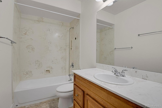 full bathroom with tile patterned flooring, vanity, tiled shower / bath combo, and toilet