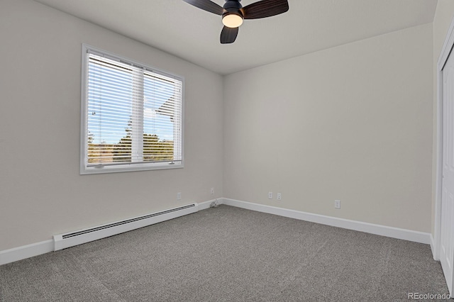 empty room with carpet, baseboards, and baseboard heating