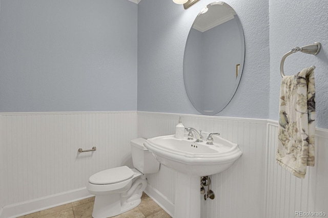 bathroom featuring tile patterned flooring and toilet