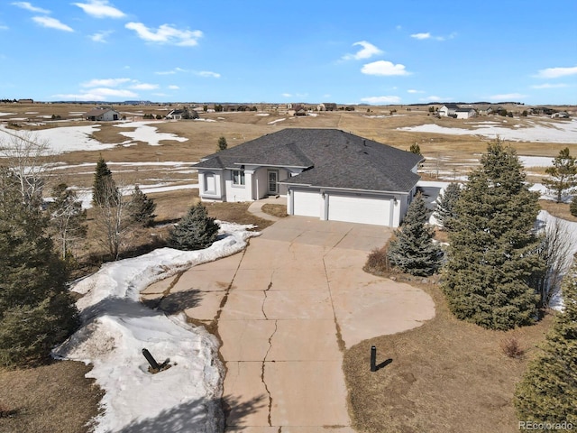 view of front facade with a garage and concrete driveway