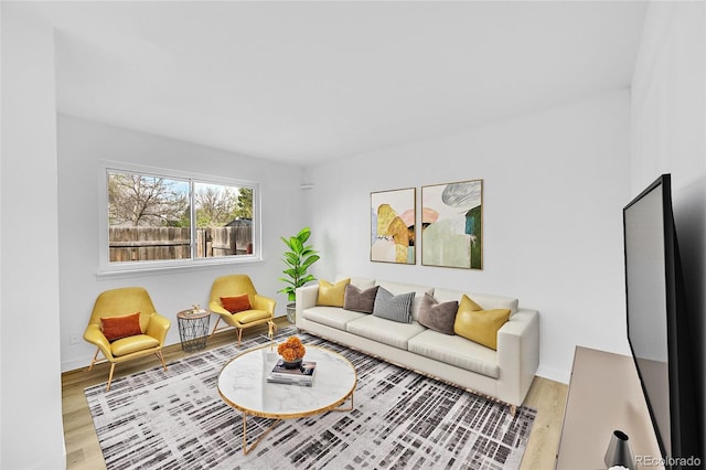 living room with wood finished floors and baseboards