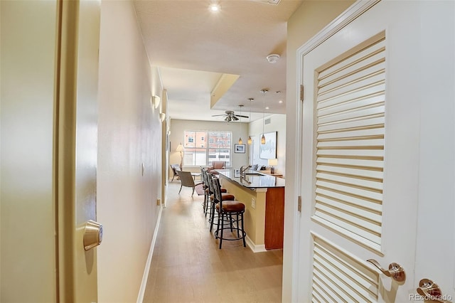 1975 Grant St Unit 501, Denver, CO 80203 - hallway with light wood finished floors and baseboards