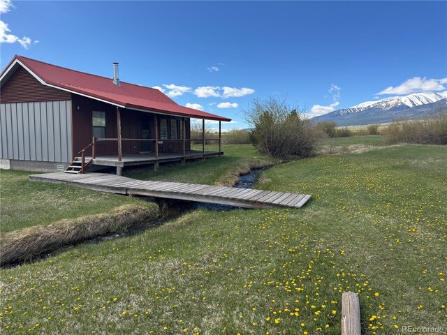 700 County Road 150, Westcliffe, CO 81252 - view of grassy yard featuring a deck with mountain view