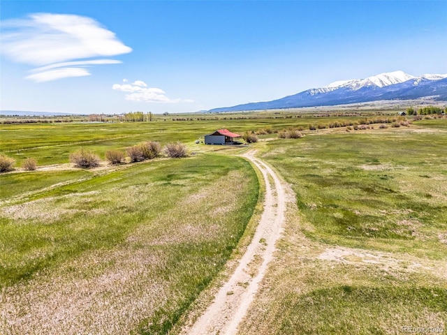 700 County Road 150, Westcliffe, CO 81252 - overview of rural landscape featuring a mountainous background and agricultural land