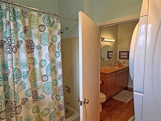 700 County Road 150, Westcliffe, CO 81252 - bathroom featuring wood finished floors, vanity, toilet, and shower / bath combination with curtain