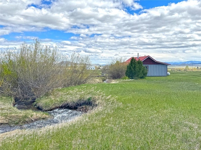 700 County Road 150, Westcliffe, CO 81252 - view of green lawn with an outdoor structure