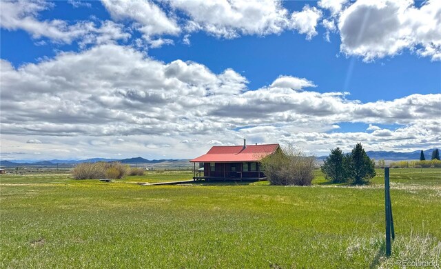 700 County Road 150, Westcliffe, CO 81252 - view of green lawn with a view of countryside and a mountain view