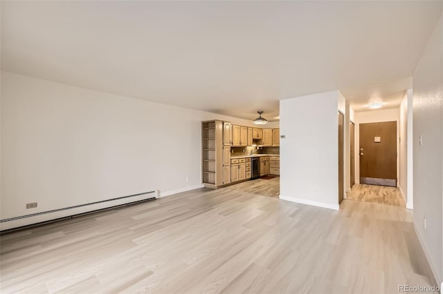 unfurnished living room featuring a ceiling fan, baseboard heating, baseboards, and light wood finished floors