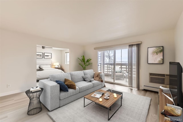 living area featuring an AC wall unit, baseboards, baseboard heating, and wood finished floors