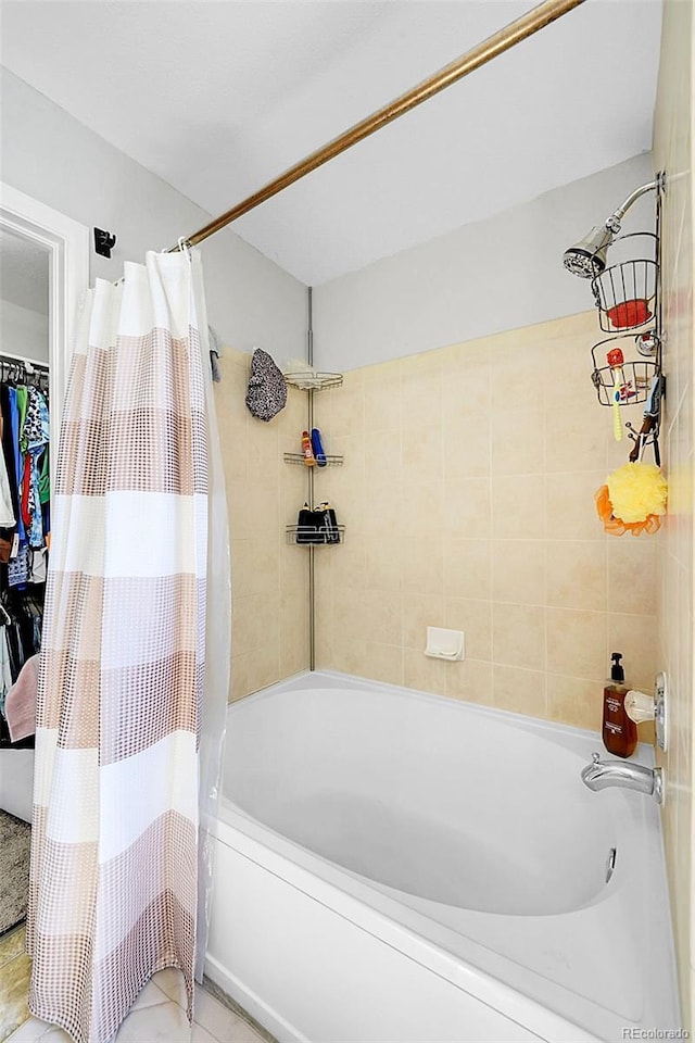 bathroom with shower / bathtub combination with curtain