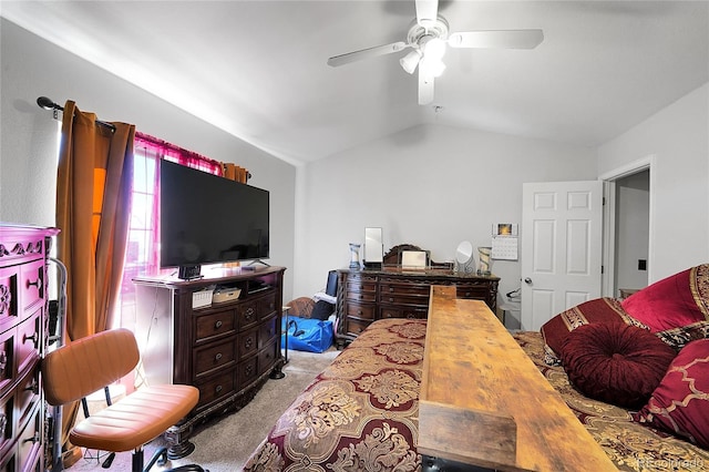 bedroom with vaulted ceiling, carpet flooring, and a ceiling fan