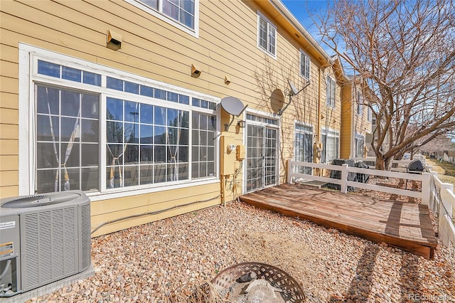 rear view of property with central air condition unit