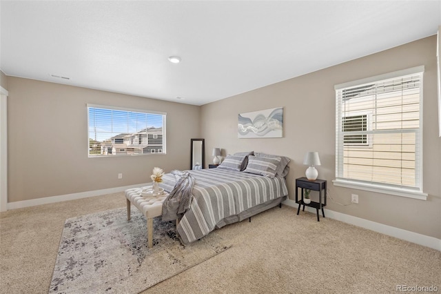 carpeted bedroom with baseboards