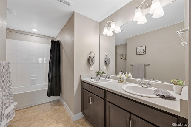 bathroom with double vanity, shower / bath combo with shower curtain, and baseboards