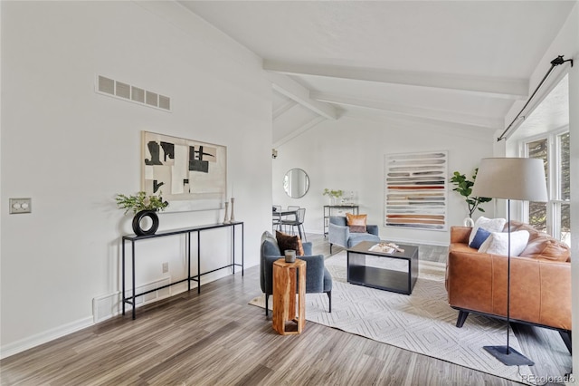living room featuring wood finished floors and baseboards