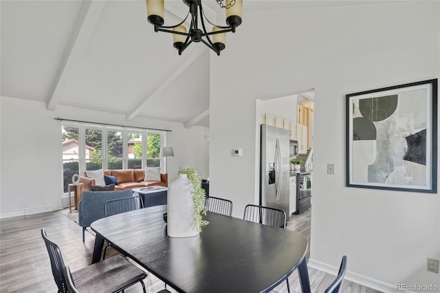 dining room with a chandelier, light wood finished floors, beamed ceiling, high vaulted ceiling, and baseboards
