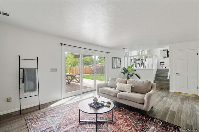living room with wood finished floors and baseboards