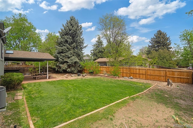 view of yard with a patio area and central air condition unit