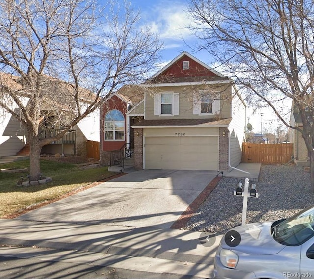 7732 Xavier Ct, Westminster, CO 80030 - traditional home featuring brick siding, a garage, and driveway