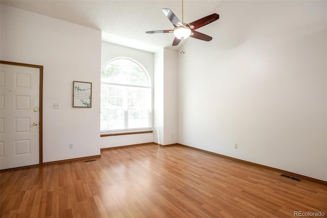 7732 Xavier Ct, Westminster, CO 80030 - empty room with vaulted ceiling, light wood-type flooring, ceiling fan, and baseboards