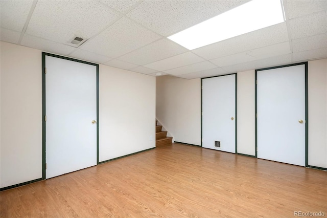 7732 Xavier Ct, Westminster, CO 80030 - unfurnished bedroom with a paneled ceiling, wood finished floors, and multiple closets