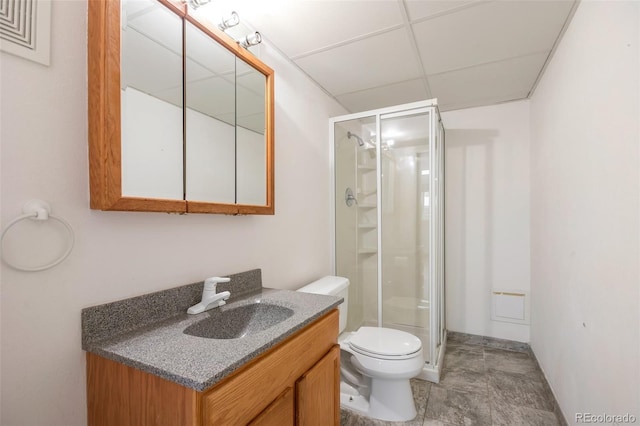 7732 Xavier Ct, Westminster, CO 80030 - bathroom with a stall shower, vanity, toilet, and a drop ceiling
