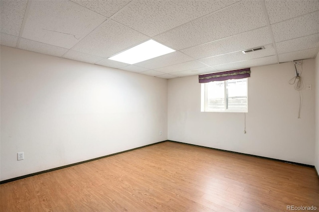 7732 Xavier Ct, Westminster, CO 80030 - spare room featuring a paneled ceiling, wood finished floors, and baseboards