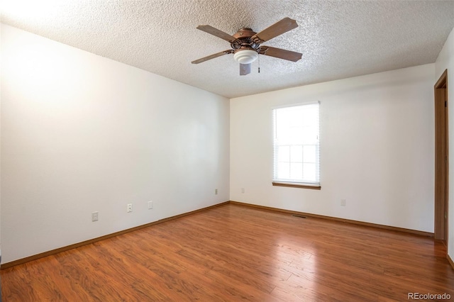 7732 Xavier Ct, Westminster, CO 80030 - empty room featuring a textured ceiling, ceiling fan, wood finished floors, and baseboards