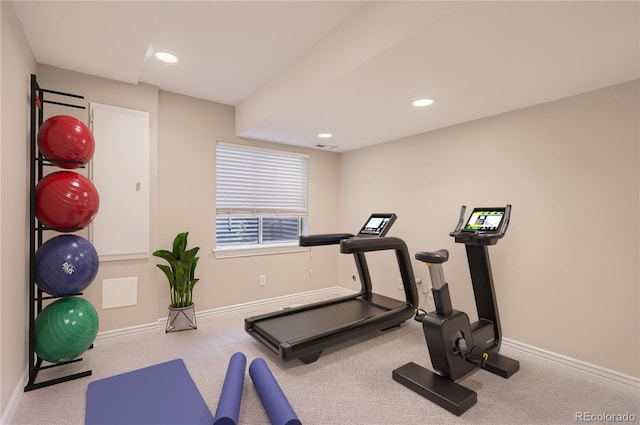 exercise area with baseboards, recessed lighting, and carpet floors