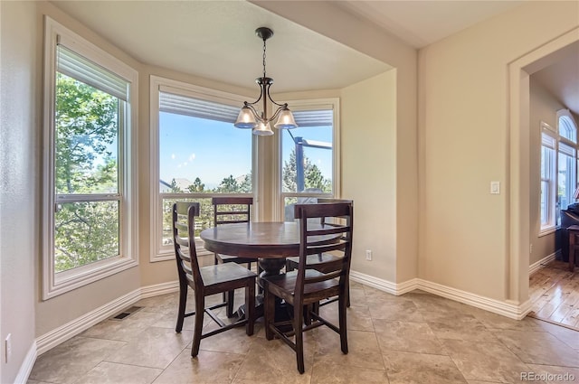 10529 Dacre Pl, Lone Tree, CO 80124 - dining room featuring a chandelier and baseboards