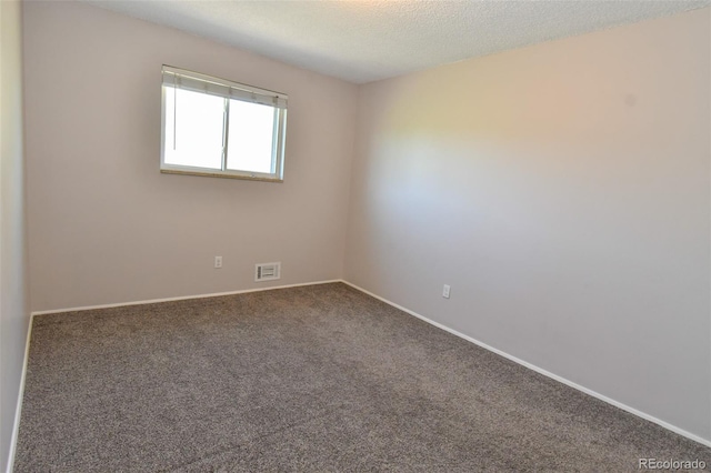 5719 S Lowell Blvd, Littleton, CO 80123 - carpeted spare room with baseboards and a textured ceiling