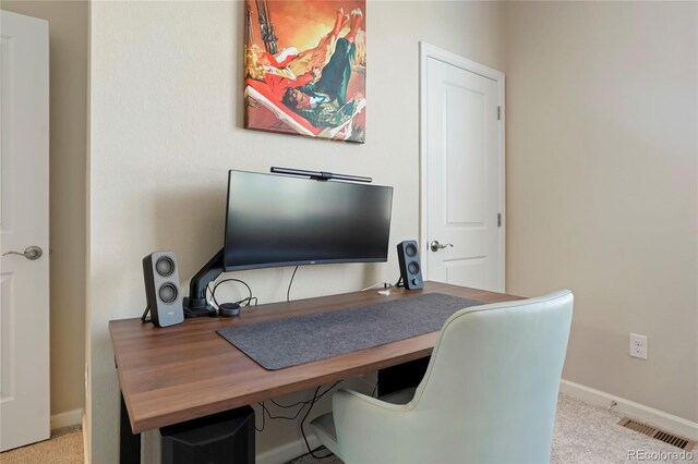 carpeted home office with baseboards and visible vents