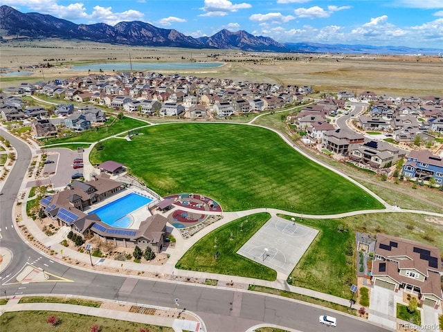 bird's eye view with a water and mountain view and a residential view
