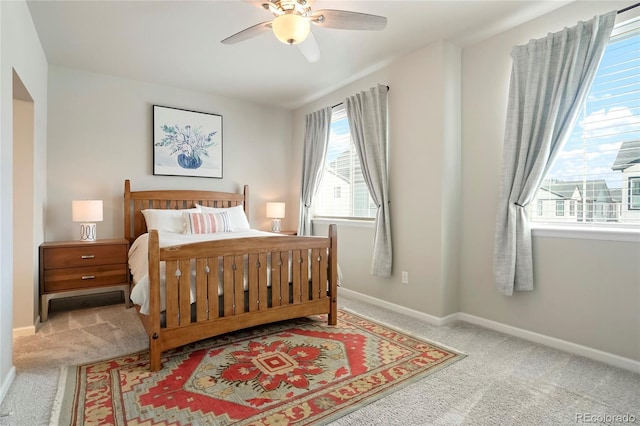 bedroom featuring baseboards, carpet flooring, and a ceiling fan