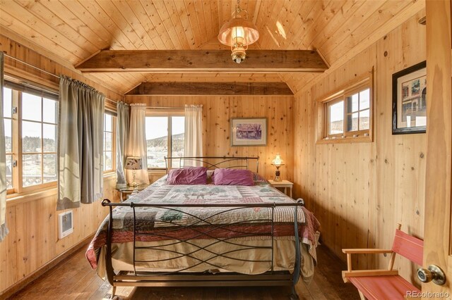 3750 Singletree Rd, Hartsel, CO 80449 - bedroom featuring wood-type flooring, visible vents, vaulted ceiling with beams, and multiple windows