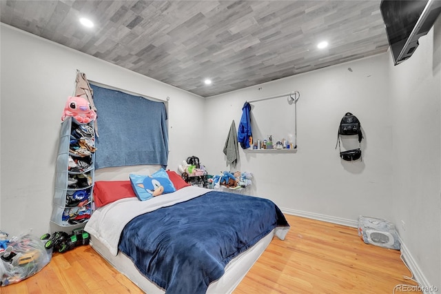 bedroom with hardwood / wood-style flooring