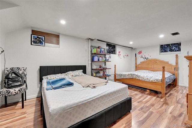 bedroom with light hardwood / wood-style floors