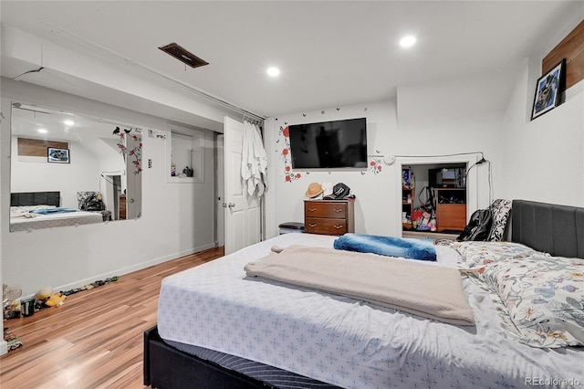 bedroom featuring hardwood / wood-style flooring