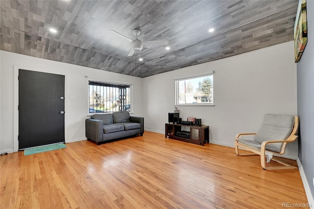 sitting room featuring ceiling fan, light hardwood / wood-style floors, and a healthy amount of sunlight