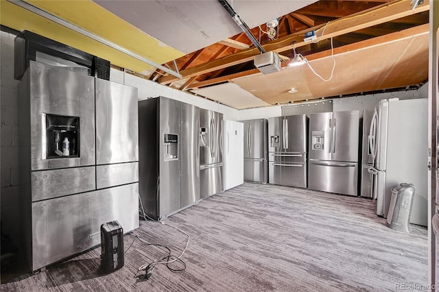 kitchen featuring stainless steel refrigerator with ice dispenser