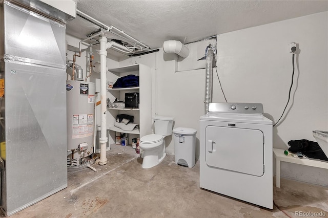 laundry area featuring washer / clothes dryer, water heater, and a textured ceiling