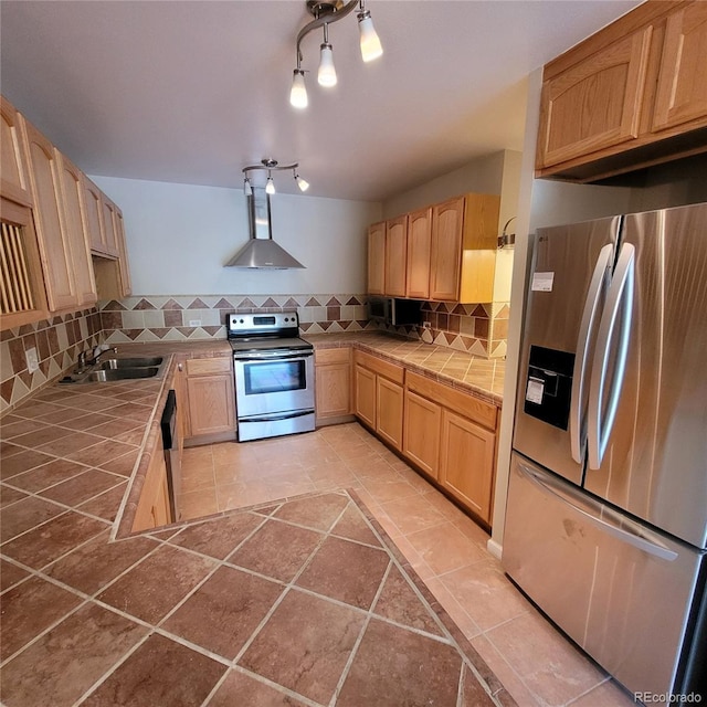 755 S Clinton St Unit 6B, Denver, CO 80247 - kitchen with stainless steel appliances, tile counters, and light brown cabinets