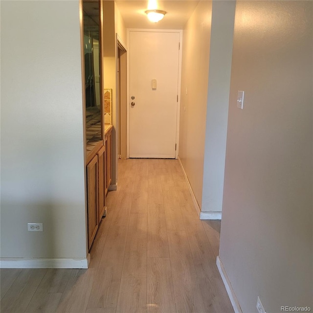 755 S Clinton St Unit 6B, Denver, CO 80247 - hall with light wood finished floors and baseboards
