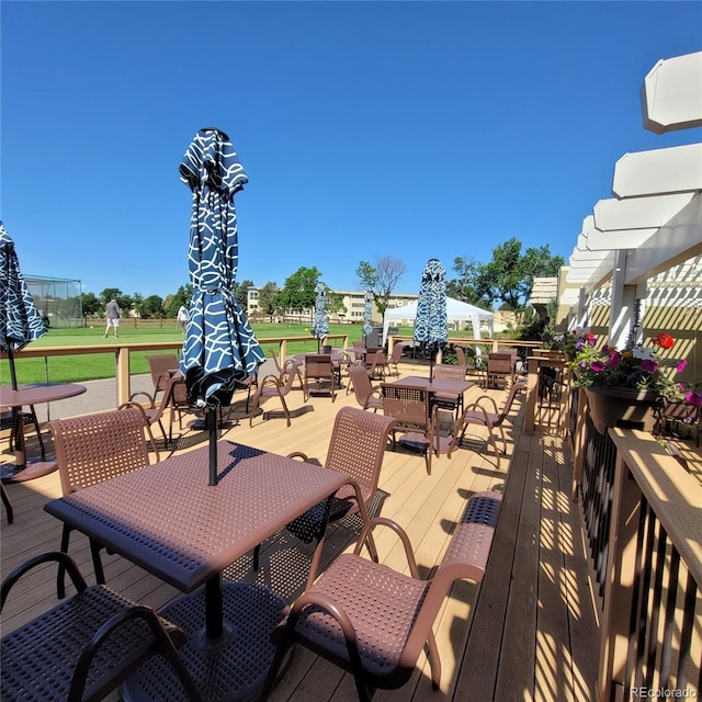 755 S Clinton St Unit 6B, Denver, CO 80247 - wooden deck featuring outdoor dining space