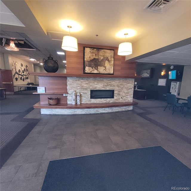 755 S Clinton St Unit 6B, Denver, CO 80247 - welcome area featuring a stone fireplace