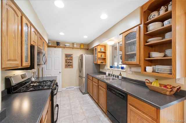 kitchen with open shelves, a sink, stainless steel appliances, glass insert cabinets, and dark countertops