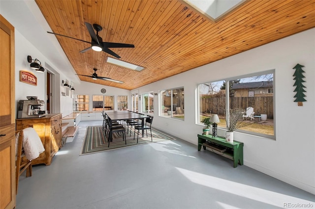 view of patio with outdoor dining area, ceiling fan, and fence