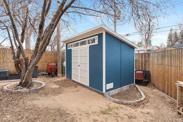 view of shed with central AC and a fenced backyard